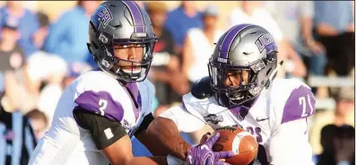  ?? Photo courtesy of UCA ?? Quarterbac­k Breylin Smith (left) and the University of Central Arkansas offense are averaging 371.3 yards per game this season behind an offensive line that returned only one starter from a year ago.