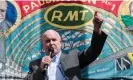  ?? Photograph: Anadolu Agency/ Getty Images ?? ‘This ‘black hole’ isn’t the same as looking at real wages – currently falling rapidly – or rising unemployme­nt today.’ The RMT’s Mick Lynch speaks during a rally at King’s Cross station.
