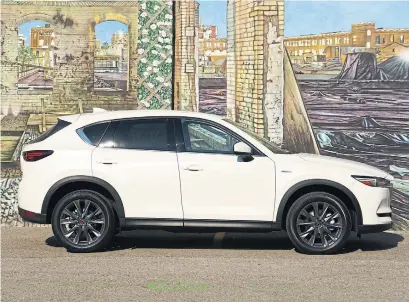  ?? KUNAL D’SOUZA PHOTOS WHEELS.CA ?? The Mazda CX-5 sports a clean design, with the 100th Anniversar­y Edition featuring Snowflake White Pearl paint.