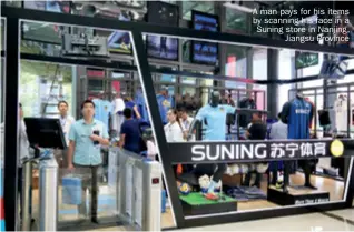  ??  ?? A man pays for his items by scanning his face in a Suning store in Nanjing, Jiangsu Province