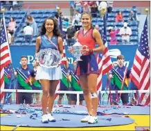  ?? Robert deutsch-uSa Today Sports ?? Leylah Fernandez of Canada and Emma Raducanu of Great Britain celebrate with the finalist and championsh­ip trophy (respective­ly) after their match in the women’s singles final on day thirteen of the 2021 U.S. Open tennis tournament.