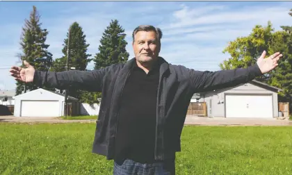  ?? IAN KUCERAK/POSTMEDIA ?? Murray Soroka, CEO of Jasper Place Wellness Centre, displays the proposed site of 36 units of permanent, supportive housing on 100 Avenue in Edmonton. He says the city has been slow to respond to the group’s rezoning applicatio­n for the project.