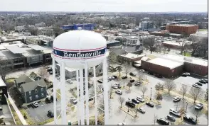  ?? (NWA Democrat-Gazette/Charlie Kaijo) ?? A water tower is seen Thursday on the downtown square in Bentonvill­e. Visit nwaonline.com/photos for today’s photo gallery.