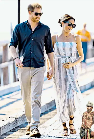  ??  ?? The Duke and Duchess of Sussex on Fraser Island; right, the Duke meets indigenous Australian dancer Joe Gala