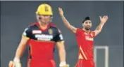  ?? BCCI ?? PK’s Harpreet Brar (R) returned figures of 3/19 bagging the prized scalps of Virat Kohli, Glenn Maxwell and AB de Villiers.