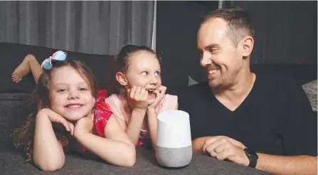  ?? Picture: RICHARD GOSLING ?? Radio presenter Christo has fun trying out the Google Home speaker with his kids, Noa, 4, and Lila, 7.