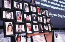  ?? FILE PHOTO ?? Photos of missing persons are displayed on an easel as part of an informatio­nal display for the 13th annual NYS Missing Persons Day, held Saturday, April 5, 2014, at the New York State Museum in Albany.