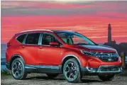  ??  ?? The long hood, longer wheelbase, short rear overhang and dual exhausts give the new CR-V a more sophistica­ted and athletic presence.