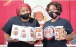  ?? GERSH / THE COMMERCIAL APPEAL MAX ?? Tamika Heard (left), social media market manager for Makeda’s Homemade Butter Cookies, and her sister, Raven Winton, general manager of the South Second Street location on Wednesday, Sept. 30, in Memphis.