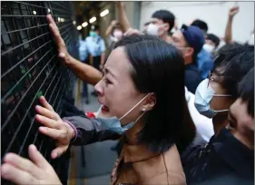  ?? REUTERS ?? A family member cries and bids farewell to a prison van after an anti-government protester Sin Ka-ho was sentenced to four years for rioting, in Hong Kong on Friday.