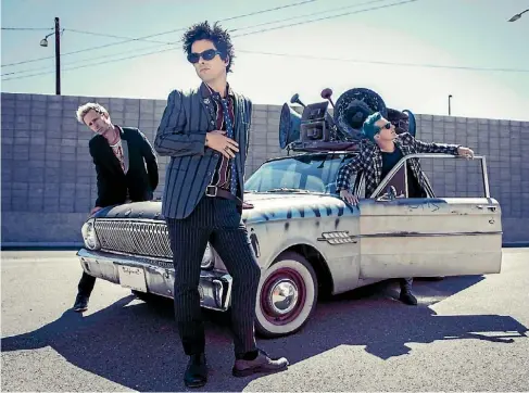  ??  ?? ‘‘It’s a great life,’’ says bassist Mike Dirnt, right, ‘‘We’ve lived and learned everything through this band.’’