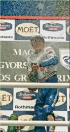  ??  ?? Michael Doohan sprays the champagne at Hungary in 1990.