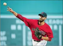  ?? ELISE AMENDOLA/AP PHOTO ?? Red Sox starting pitcher Rick Porcello delivers to the Yankees in the first inning of Friday’s game at Fenway Park in Boston.