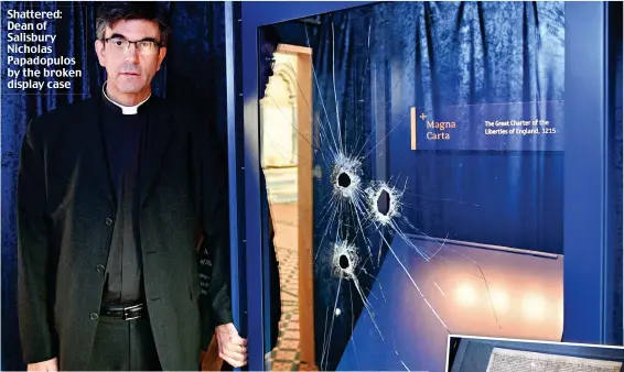  ??  ?? Shattered: Dean of Salisbury Nicholas Papadopulo­s by the broken display case