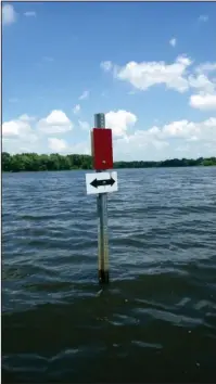  ?? The Sentinel-Record/Corbet Deary ?? BOATING LANES: Designated boating lanes throughout Lake Overcup provide anglers with routes that are free of standing timber and other submerged debris.