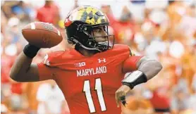  ?? ROB CARR/GETTY IMAGES ?? Kasim Hill was 17-for-29 for 222 yards, including a 65-yard touchdown to freshman wide receiver Jeshaun Jones, in Maryland’s 34-29 win against Texas on Saturday,