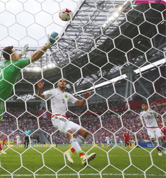  ??  ?? Beaten...keeper Igor Akinfeev concedes against Mexico