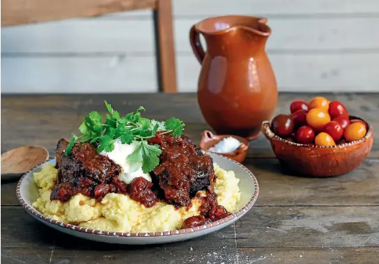  ??  ?? Delicious Mexican beef short ribs served over cheesy polenta will wow - and satisfy - your guests.