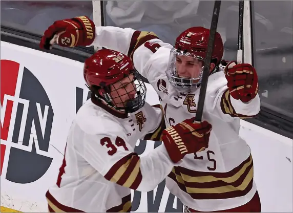  ?? STAFF PHOTO — STUART CAHILL/BOSTON HERALD ?? Boston College forward Ryan Leonard, right, celebrates his goal with forward Gabe Perreault during BC’s 8-1win over UMass during a Hockey East semifinal clash last Friday at the TD Garden in Boston.