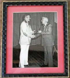  ?? COURTESY PHOTO ?? In a photograph hanging in Burton’s Barber Shop, Dallas Green is shown presenting the plaque indicating membership in the Old Timers to Joe Ted Pennock, son of baseball great and Kennett Square hometown hero Herb Pennock.