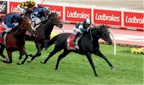  ?? GETTY IMAGES ?? Sir Dragonet strides clear to give jockey Glenn Boss his fourth Cox Plate at Moonee Valley yesterday.
