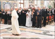  ?? Associated Press ?? Pope Francis meets at the Vatican Friday with participan­ts of a Catholic Church-backed internatio­nal conference on fighting child pornograph­y and protecting children in the digital age.