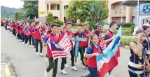  ??  ?? KONTINJEN pelajar SMK Sapulut.