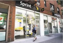  ??  ?? The Justice Department on Friday approved the merger of TMobile and Sprint, the third and fourthlarg­est wireless companies in the U.S., moving the deal one crucial step closer to completion.