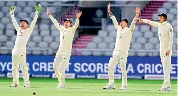  ?? AP ?? (From left) England’s Jos Buttler, Joe Root, Ben Stokes and Zak Crawley appeal for the wicket of West Indies’ John Campbell during the second day of the second Test match at Old Trafford in Manchester, England, on Friday. —