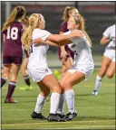  ?? MICHAEL MCCONNEY - FOR MEDIANEWS GROUP ?? Ella Curry, right, celebrates with Emily Higgins during Spring-Ford’s PAC semifinal win over Pottsgrove Tuesday.