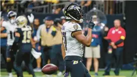  ?? BUTCH DILL/AP ?? Ravens running back Kenyan Drake celebrates after scoring a touchdown during Monday night’s game against the Saints in New Orleans.