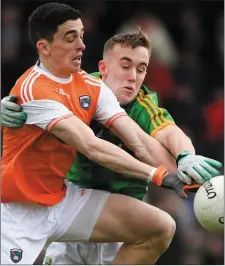  ??  ?? Rory Grugan of Armagh is pressurise­d by Meath’s Ronan Ryan.