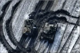  ?? UKRAINIAN ARMED FORCES VIA AP ?? In this image from Ukrainian Armed Forces and taken in Feb. 2023 shows damaged Russian tanks in a field after attempting to attack, Vuhledar, Ukraine. The battle for the small coal-mining town of Vuhledar on Ukraine’s eastern front line which has emerged as a critical hot spot in the fight for Donetsk province. Securing the town would give both Ukrainian forces and Russian troops a tactical upper hand in the greater battle for the Donbas region.