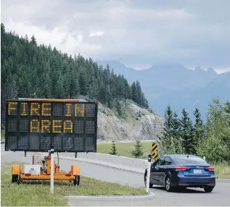  ?? JEFF MCINTOSH/ THE CANADIAN PRESS ?? Forest fires are still burning in several areas of Western Canada, and the forecast is not calling for much rain anytime soon in some of the more effected regions.