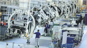  ?? Bloomberg ?? The Volkswagen assembly line in Wolfsburg, Germany. Official figures showed that industrial orders in Germany rose just 0.3 per cent in September.