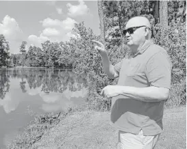  ?? Michael Wyke ?? Timarron Lakes resident Frank Gore, whose home has flooded twice in three years, says he and other homeowners who pay property taxes to MUD 386 shouldn’t have to also pay the bill for what he said was a drainage system that didn’t work.