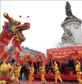  ?? GAO JING / XINHUA ?? People attend the Chinese New Year parade in Paris, France, on Jan 22.