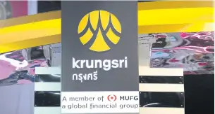  ?? PATIPAT JANTHONG ?? The Krungsri Bank logo is shown at a money expo event.