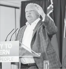  ?? GARY YOKOYAMA THE HAMILTON SPECTATOR ?? Doug Ford tells reporters his party is ready to govern from Day One during a campaign stop at the Hilton Garden Inn in Burlington Wednesday morning.