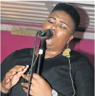  ?? Picture: LONDEKA DLAMINI ?? SONGS OF HONOUR: Bay singer Nomabotwe Mtimkhulu paid tribute to fallen legends with song at the ‘Tribute to Hugh Masekela’ show at Corner Lounge in New Brighton on Saturday