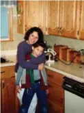  ??  ?? Glen at age 8, with Donna in the kitchen of the family home.