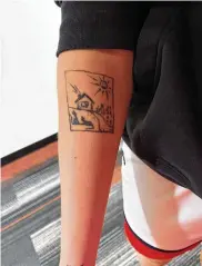  ?? ROSS BAGIENSKI / UD ATHLETICS ?? Dayton women’s basketball player Taisiya Kozlova displays the tattoo depicting her home in Moscow, Russia.