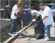  ??  ?? Volunteers gathered to pick up trash along the sidewalks, in the streets and even out of the storm drains as part of Project Longevity’s cleanup of Hill South.