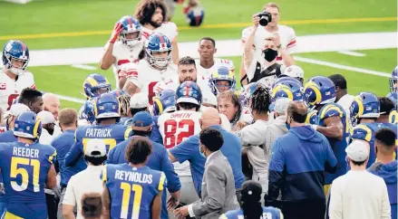  ?? JAE C HONG/AP ?? Players from the Giants and Rams scuffle at the end of an NFL football game on Sunday in Inglewood, Calif.