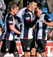  ??  ?? HEAD BOY: Lyons (centre) celebrates his winner