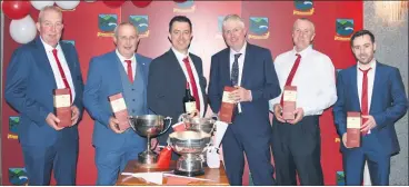  ?? (Pic: Catherine Sheehan) ?? Some of those who played a key role in Ballygibli­n’s successes in 2021 - Sean Hennessy, Liam O’Doherty, Brian Molan, T.J. Rea, Eddie Barry and Brian Coughlan - receiving presentati­ons at the Ballygibli­n GAA Social. All that was left now was to fill the cups!