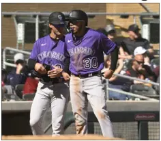  ?? RJ SANGOSTI — THE DENVER POST ?? Rockies third base coach Warren Schaeffer, left, talks with Harold Castro after his triple during a spring training Cactus League game at Salt River Fields at Talking Stick on Feb. 25in Scottsdale, Ariz.