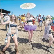  ??  ?? Dancers enjoy warm, sunny weather during last year’s festival.