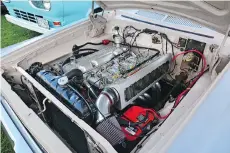  ?? PHOTOS: CAM HUTCHINS ?? The amazing slant-six engine in John Sayers’ 1962 Plymouth Belvedere station wagon includes an Offenhause­r-finned alloy valve cover, polished headers and a set of three Weber carbs.