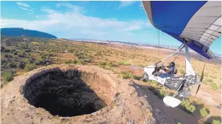  ?? COURTESY OF JEFF GILKEY ?? Here, Jeff Gilkey flies over a “weird” vent on Zia Pueblo land this past summer. He said there are about eight such vents in that area.